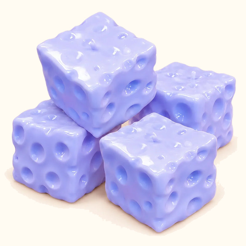 Four lavender-blue SQUEEZU Blueberry Cheese Cube Squishy toys stacked together.