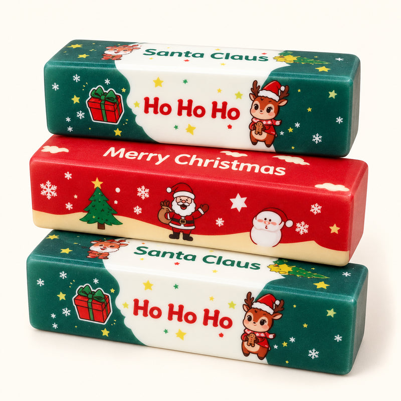 SQUEEZU Christmas Butter Bar Squishy toys in green and red with Santa, reindeer and snowflake prints.