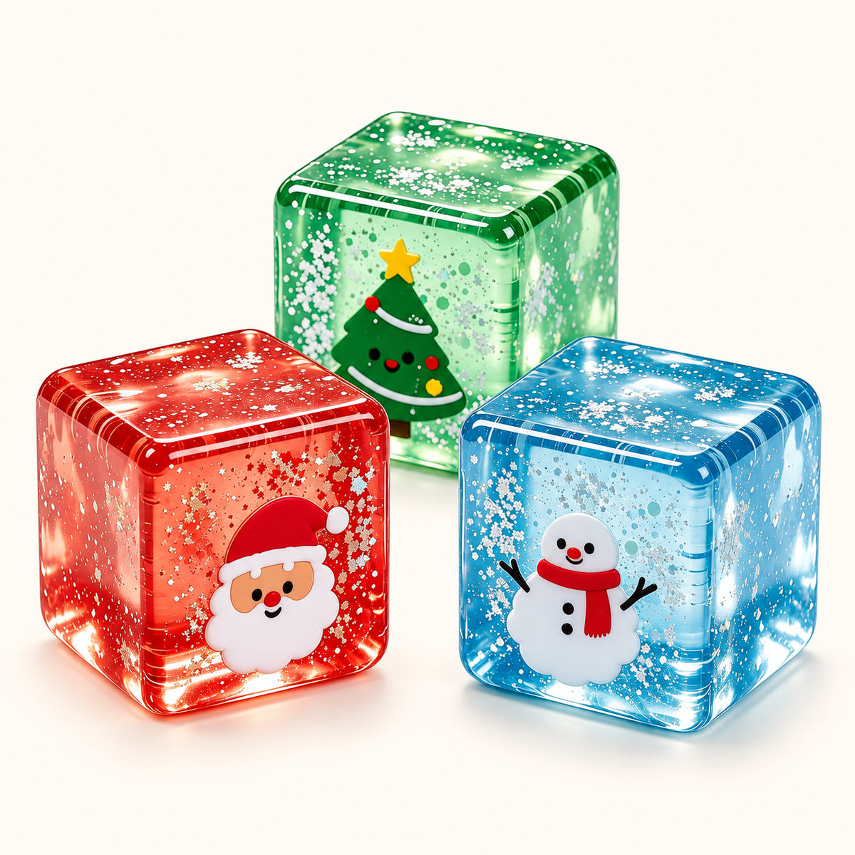 Red, blue and green SQUEEZU Christmas Ice Cube Squishy toys with Santa, snowman and Christmas tree designs.