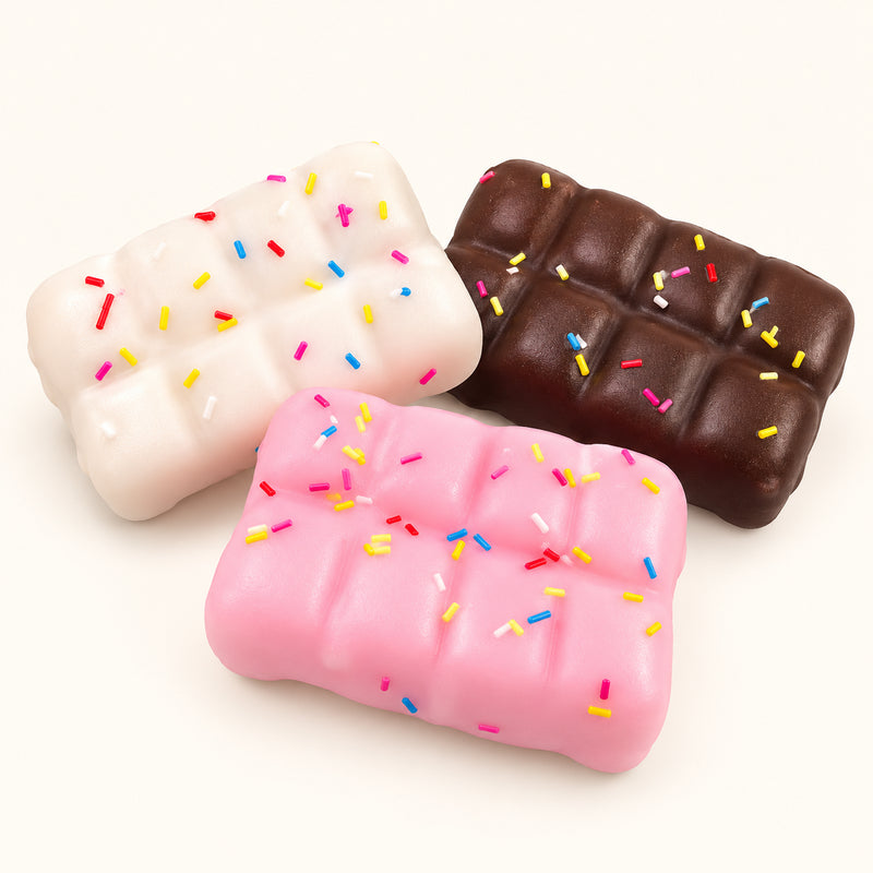 SQUEEZU Crispy Chocolate Bar Squishies in cream, pink and chocolate brown, decorated with colorful sprinkles.